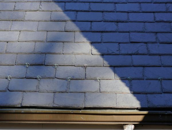slate tile roof and a portion of the gutter