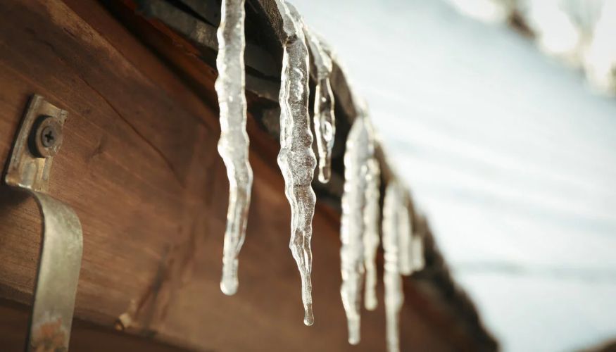 ice hanging on a roof edge