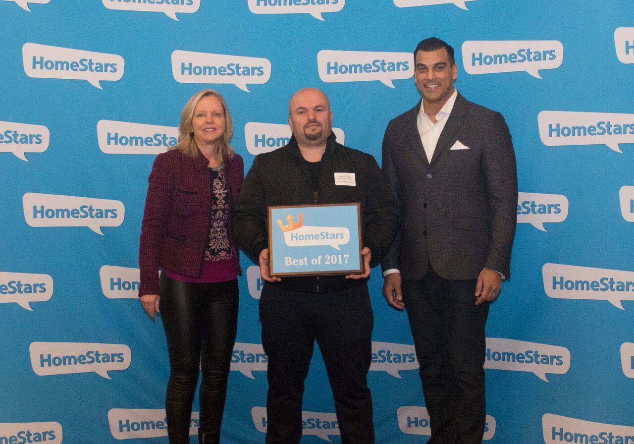 Alex Vukaj posing with Home Stars Award medal with two other Home Stars members