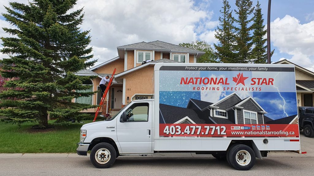 a truck with branded stickers of National Star Roofing