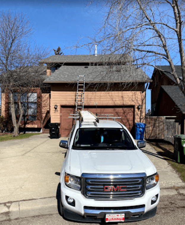 residential roofers parked on a driveway in Edmonton